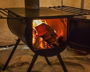 wood stove in canvas tent