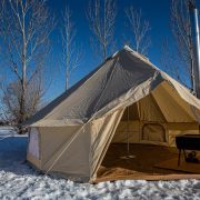inside bell tent in snow with stove
